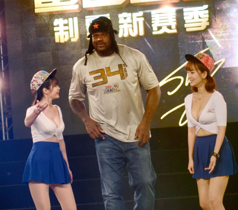 Shaq and two women.