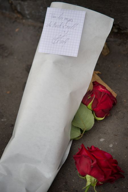 Residents leave flowers for victims and their loved ones.