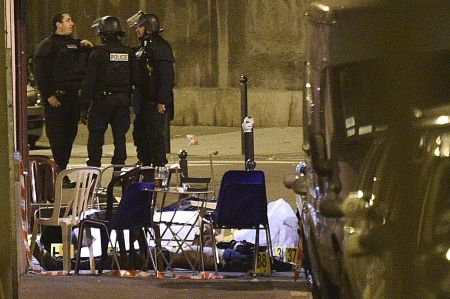 Victims lie on the ground after an attack on Rue Bichat in Central Paris.