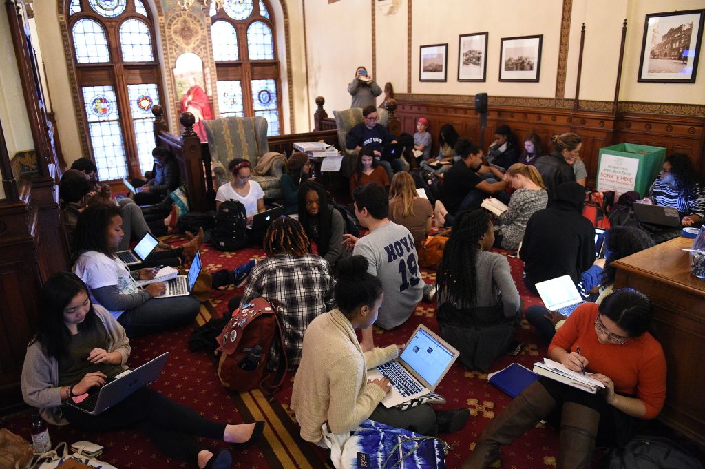 WASHINGTON, DC - NOVEMBER 13: Around 30 students sit in in fron