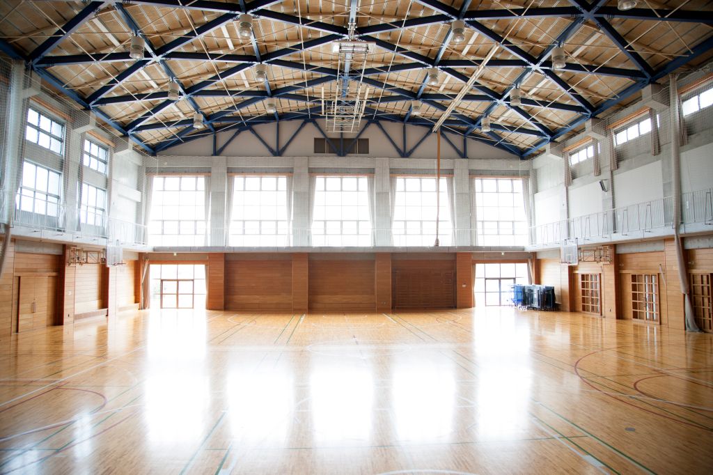 Japanese high school. An empty school gymnasium. Basketball court markings