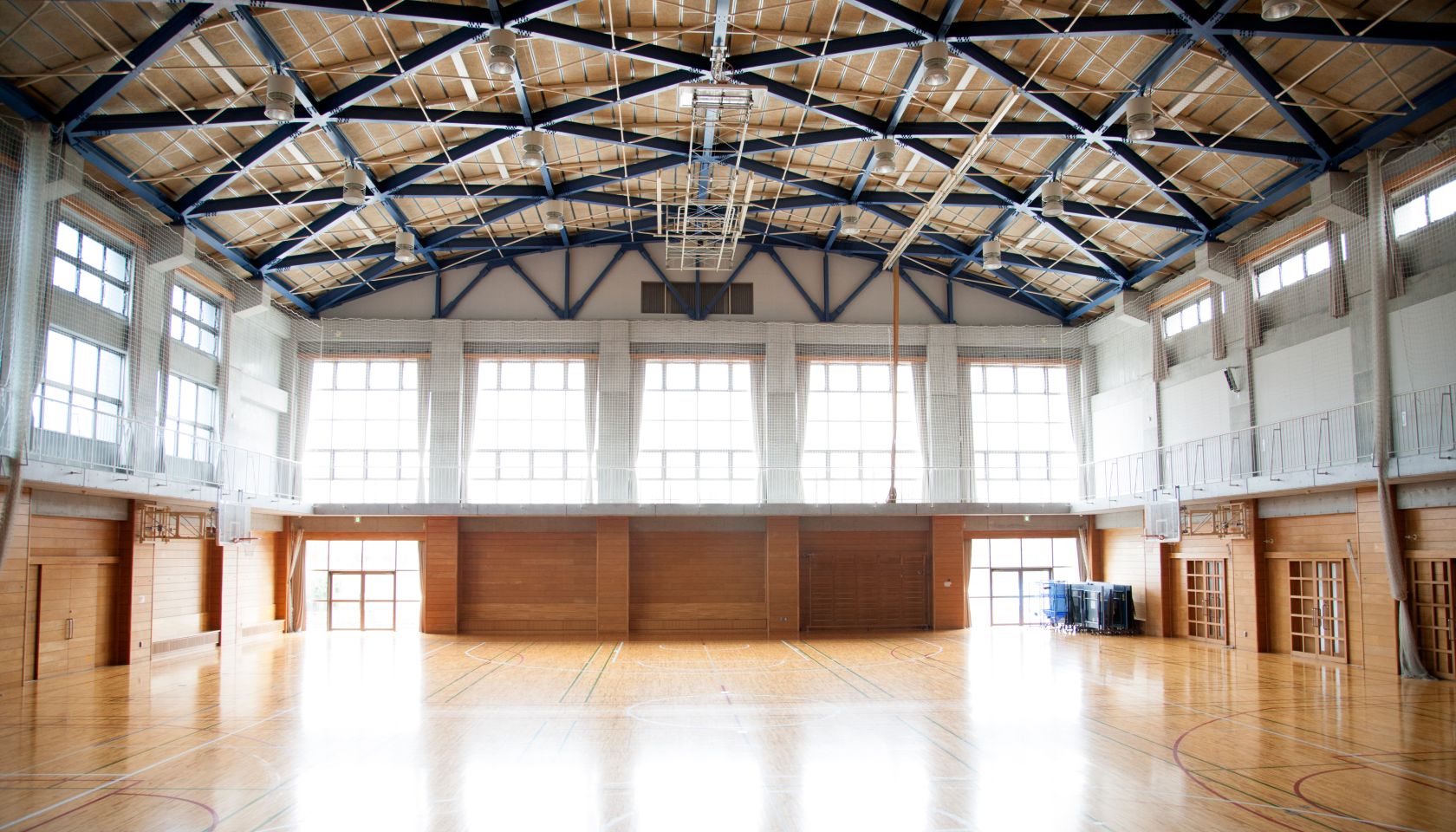 Japanese high school. An empty school gymnasium. Basketball court markings