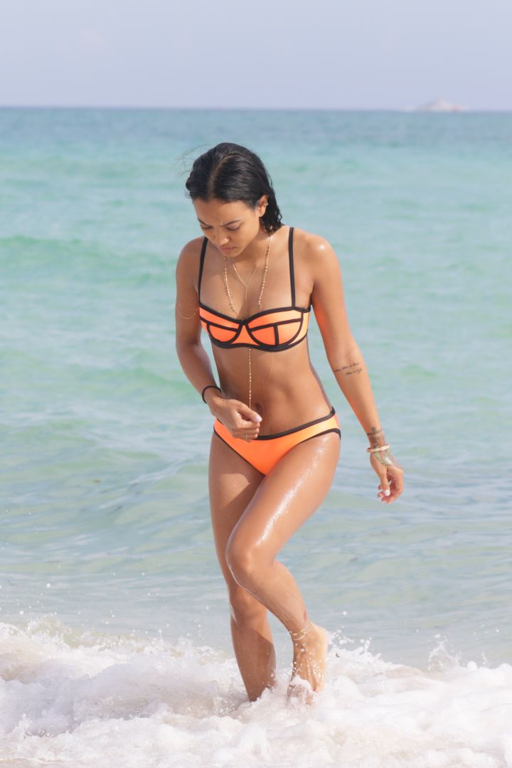 Karrueche shows off her tanned bikini body in Miami.