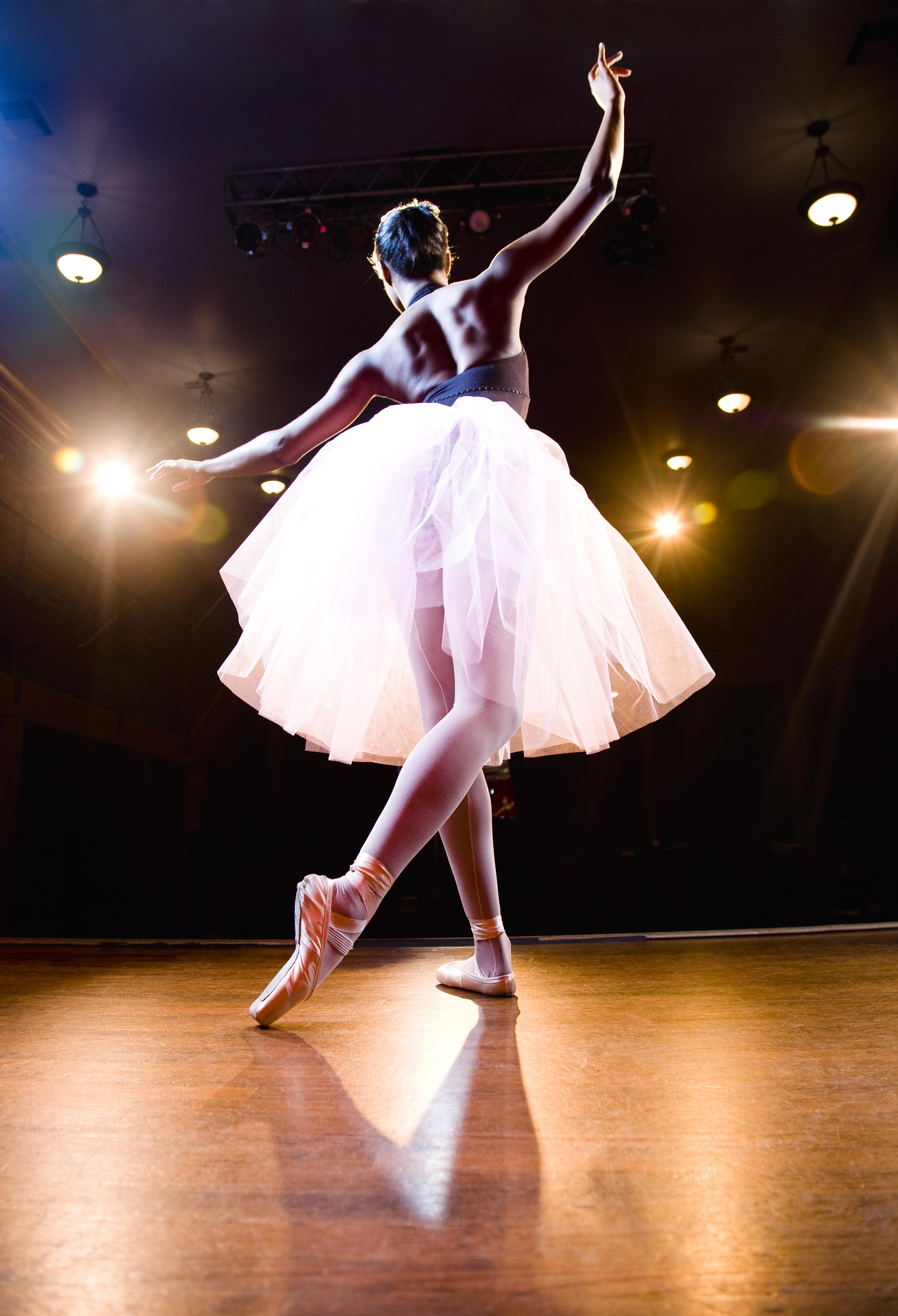 Female ballerina on stage dancing