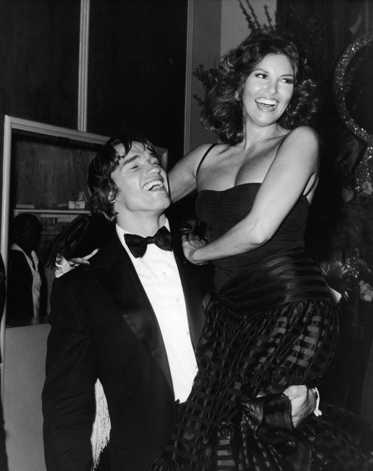 A young Arnold Schwarzenegger shared laughs with Raquel Welch in 1977.