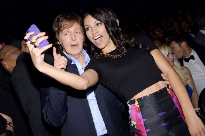 Recording artist Paul McCartney and Corinne Foxx snap a selfie together at the 56th GRAMMY Awards at Staples Center on January 26, 2014.