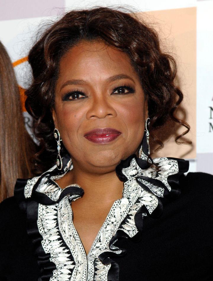 This elegant curly updo works for Oprah, the actress.