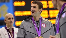 US swimmer Michael Phelps (C) shows off