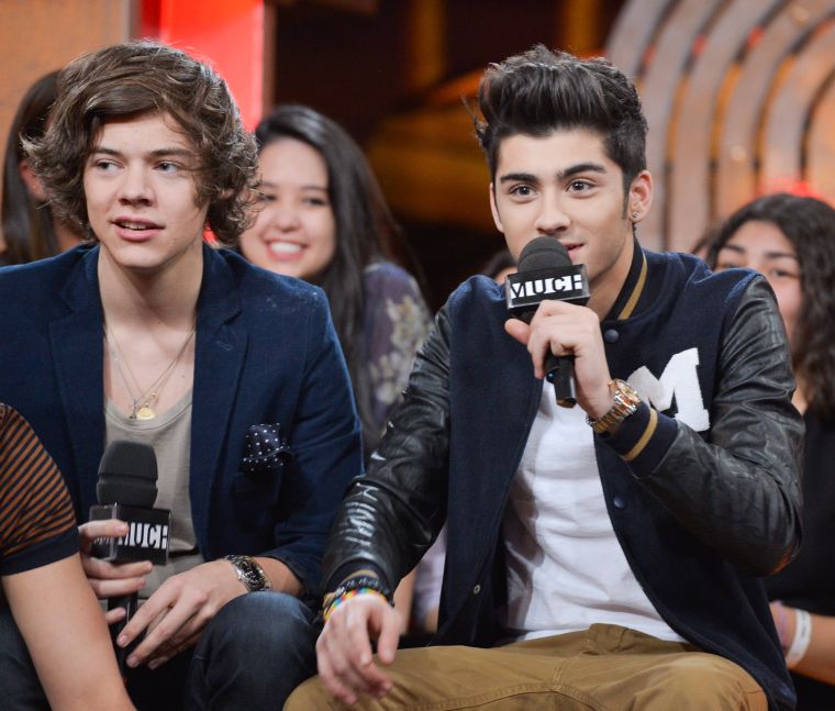 Even when the rest of his band members were getting fresh cuts, Harry stood out with his full locks.