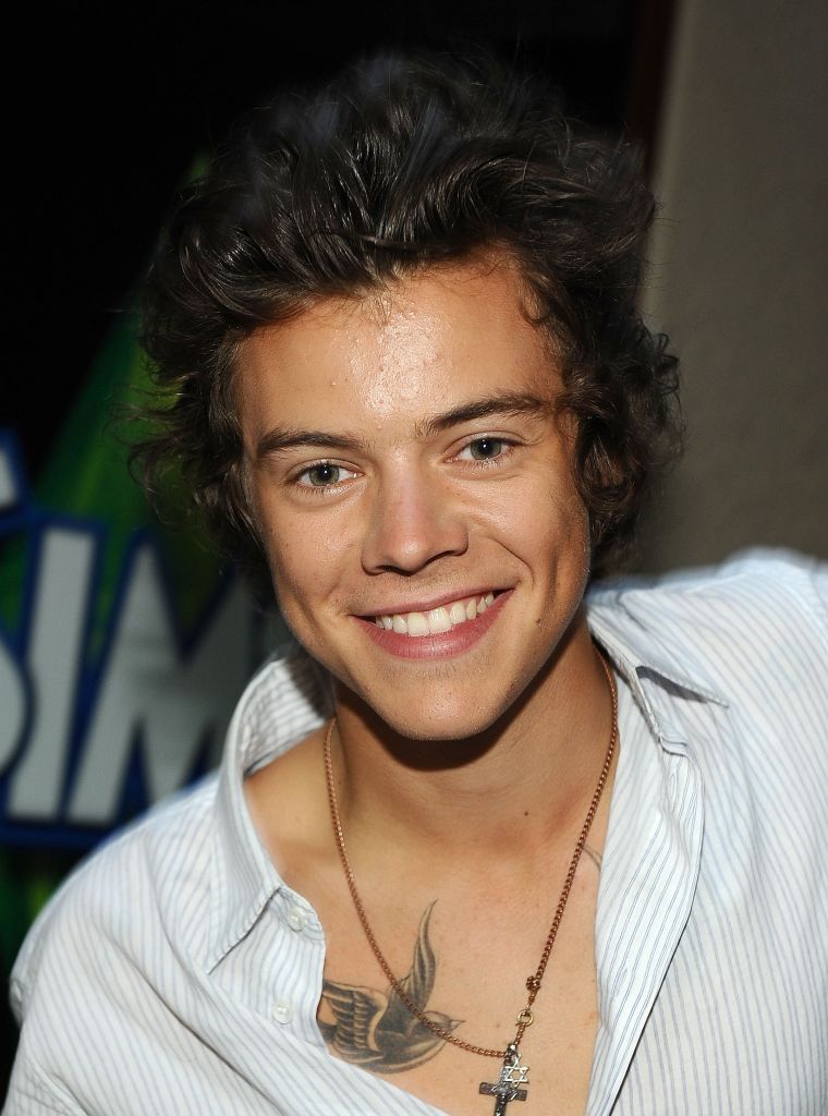 As he started to mature, Harry got rid of the bangs and we got to see his gorgeous face.