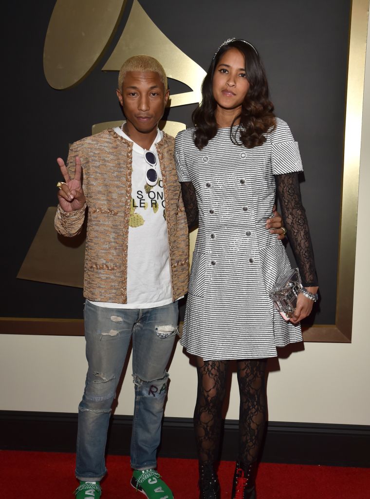 Pharrell with his wife, Helen. Are you feeling his platinum blonde 'do?
