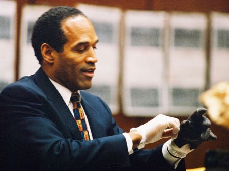O.J. tries on a glove that was used in the murder of his ex-wife.