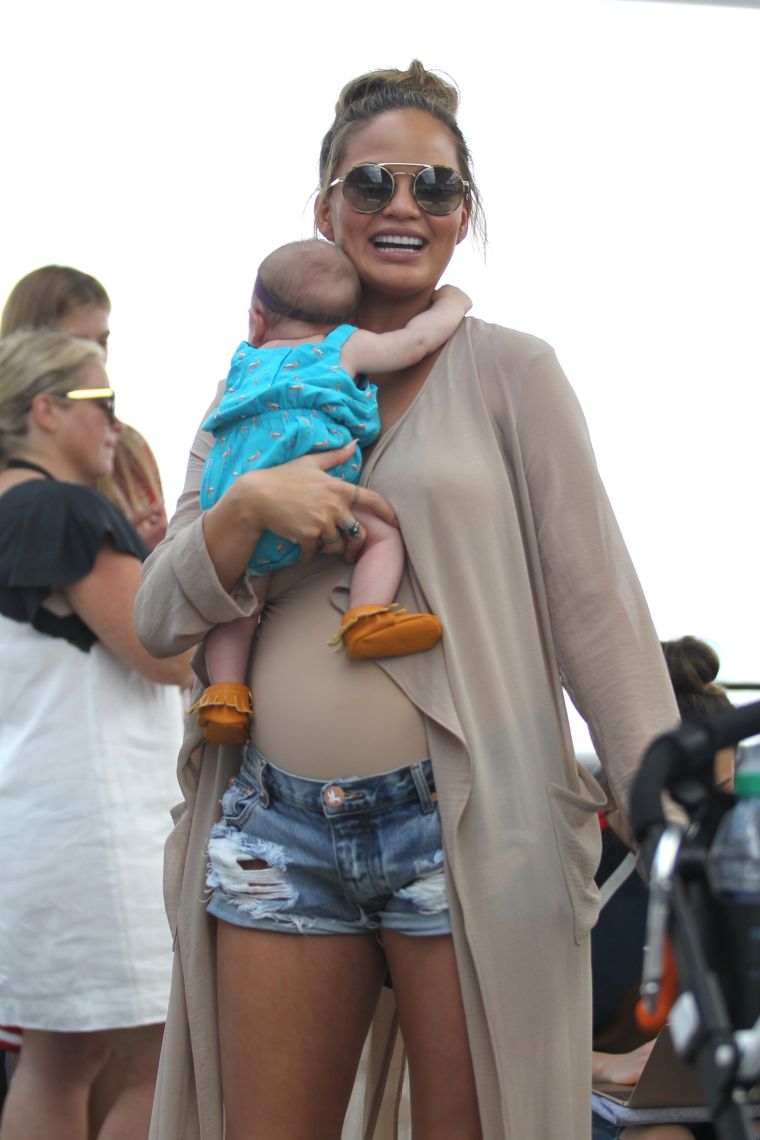 Jeans, duster, and a newborn baby that isn’t hers.