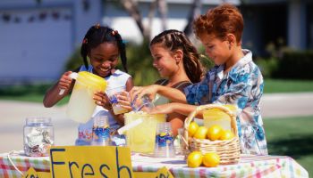 Children Selling Lemonade at Lemonade Stand