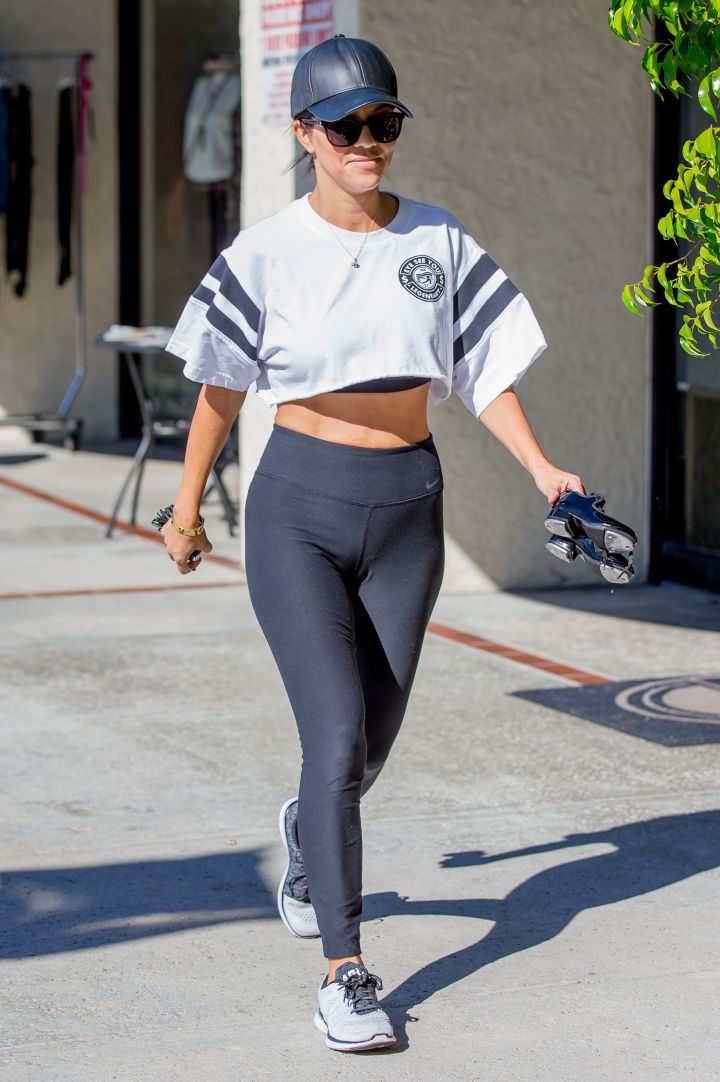Kourtney shows off her body in a crop top.