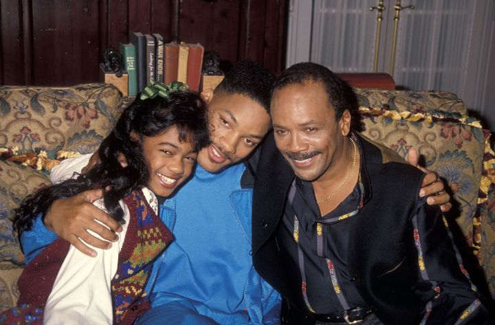 1990: Tatyana leans in for a photo with Will Smith and Quincy Jones.