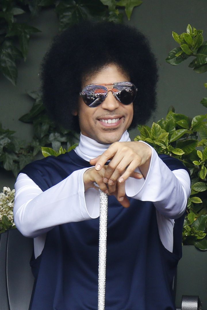US singer Prince attends the French Tennis Open round of sixteen match between Spain’s Rafael Nadal and Serbia’s Dusan Lajovic at the Roland Garros stadium in Paris on June 2, 2014.