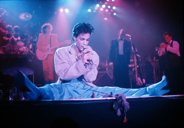 Prince performs on stage on the Hit N Run-Parade Tour, Wembley Arena, London, August 1986.