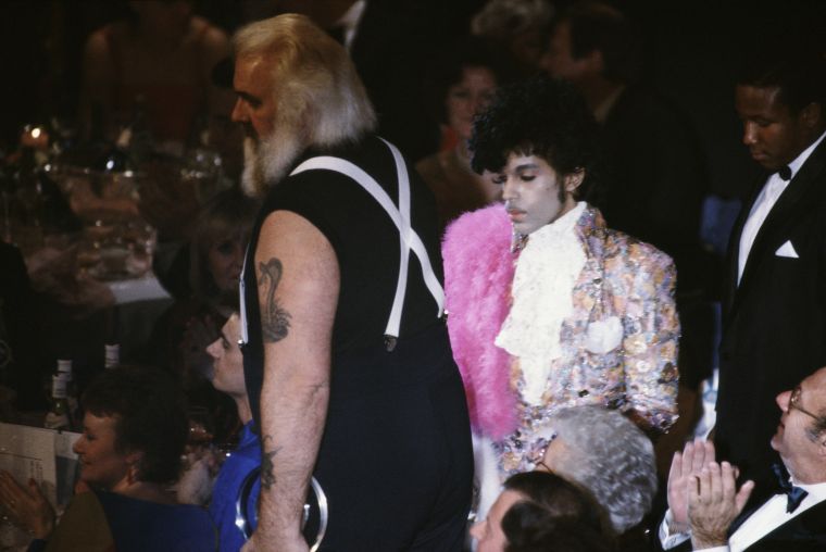 Prince stands up to collect the award for Best International Artist at the British Record Industry Awards.