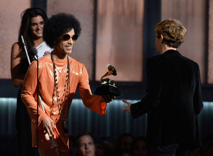 Prince presents an award to Beck at the 57th Annual GRAMMY Awards