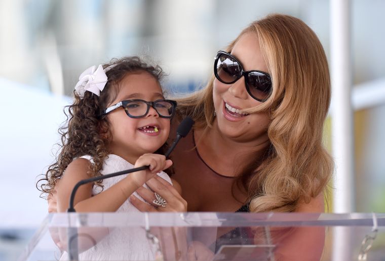 Mariah laughs with daughter Monroe