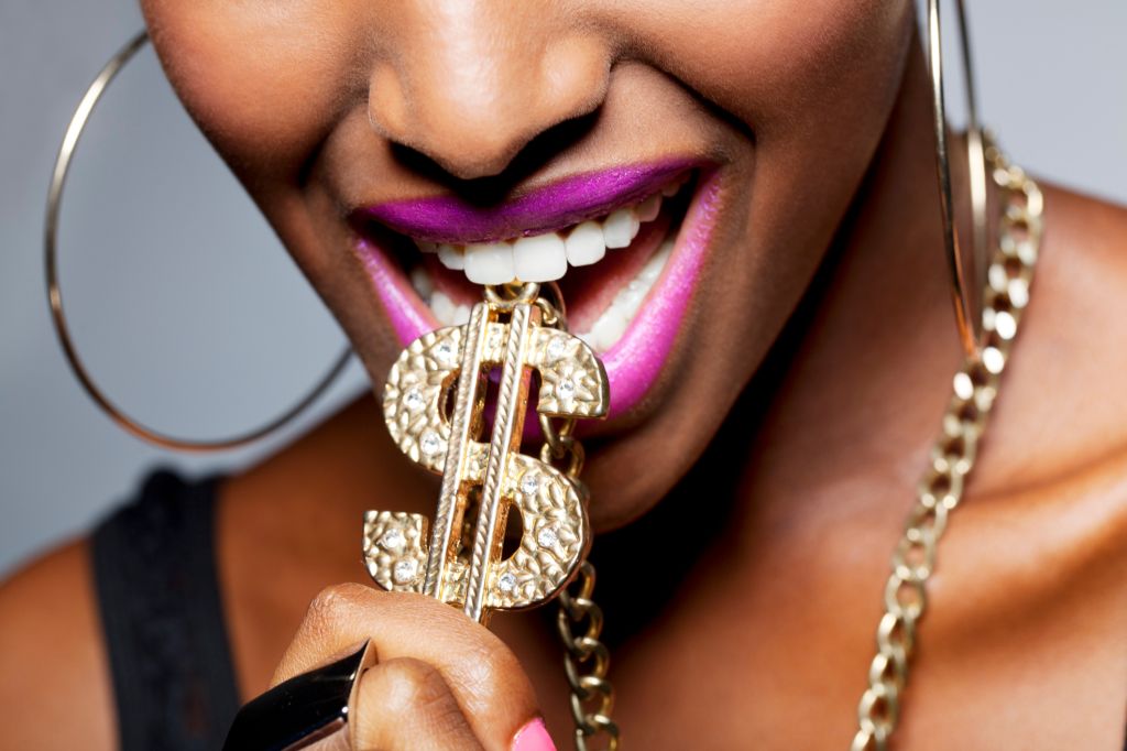 Close Up of Woman's Mouth with Dollar