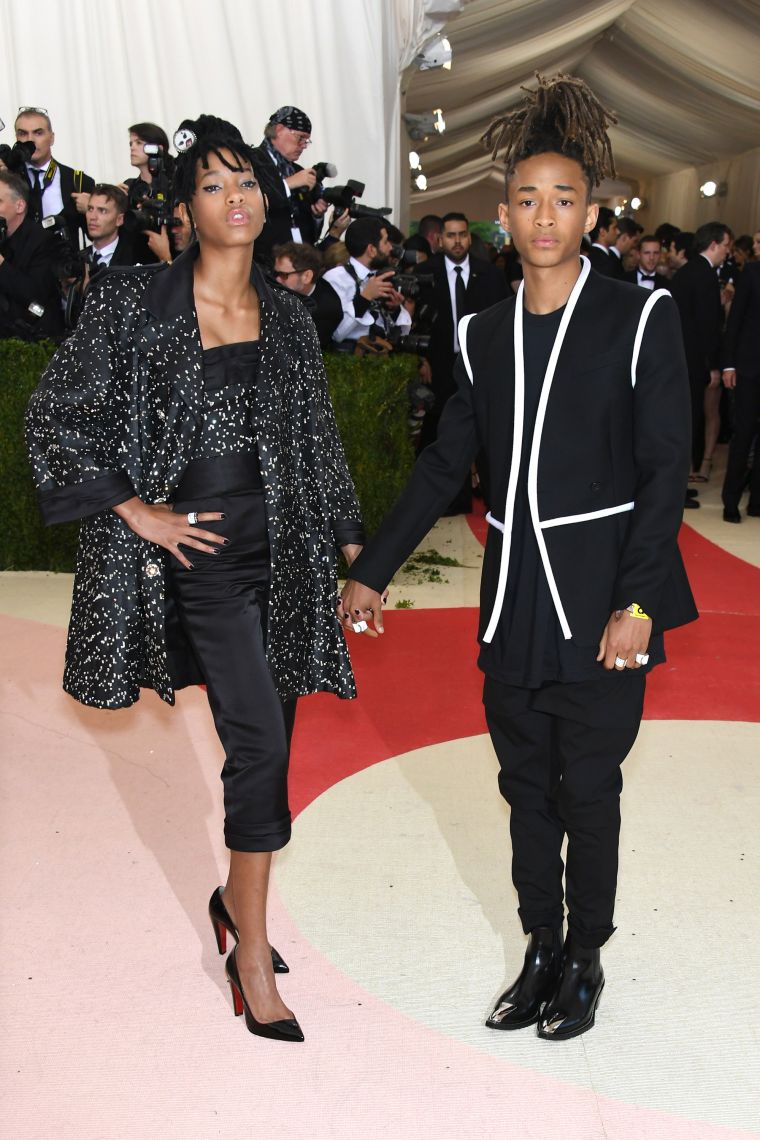 The Smith’s wear Chanel and Louis Vuitton.