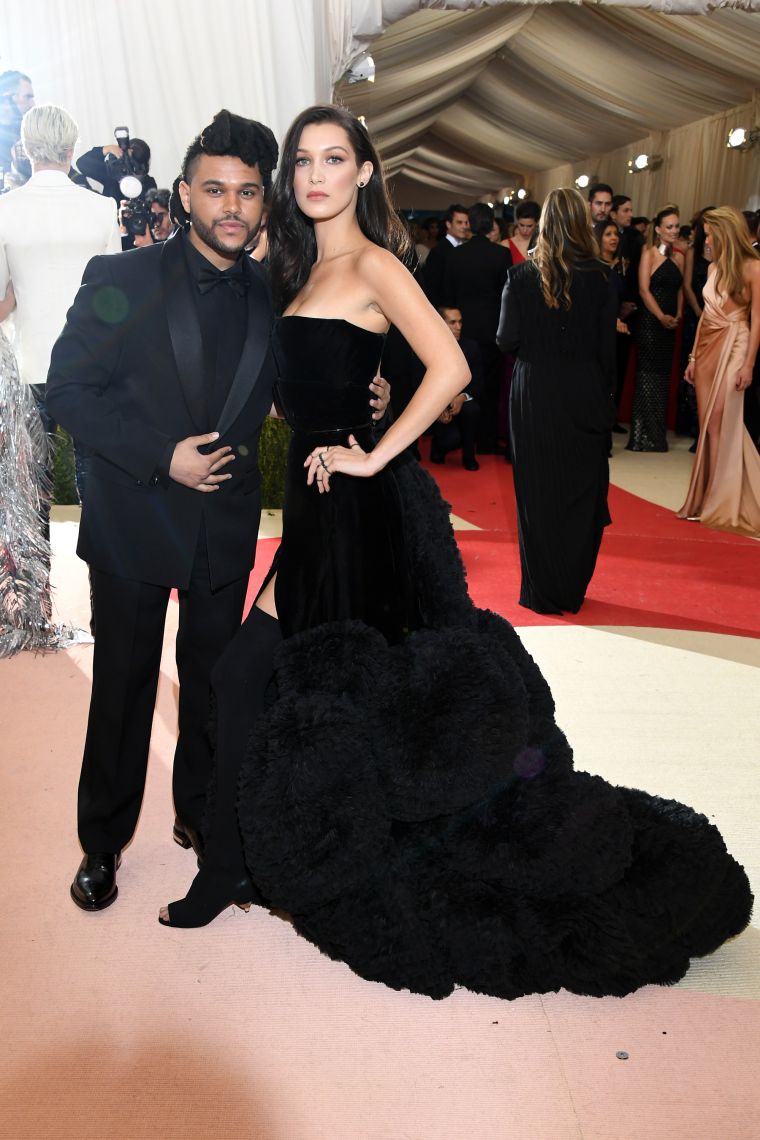 The Weeknd and Bella Hadid arrive in all black, per usual.