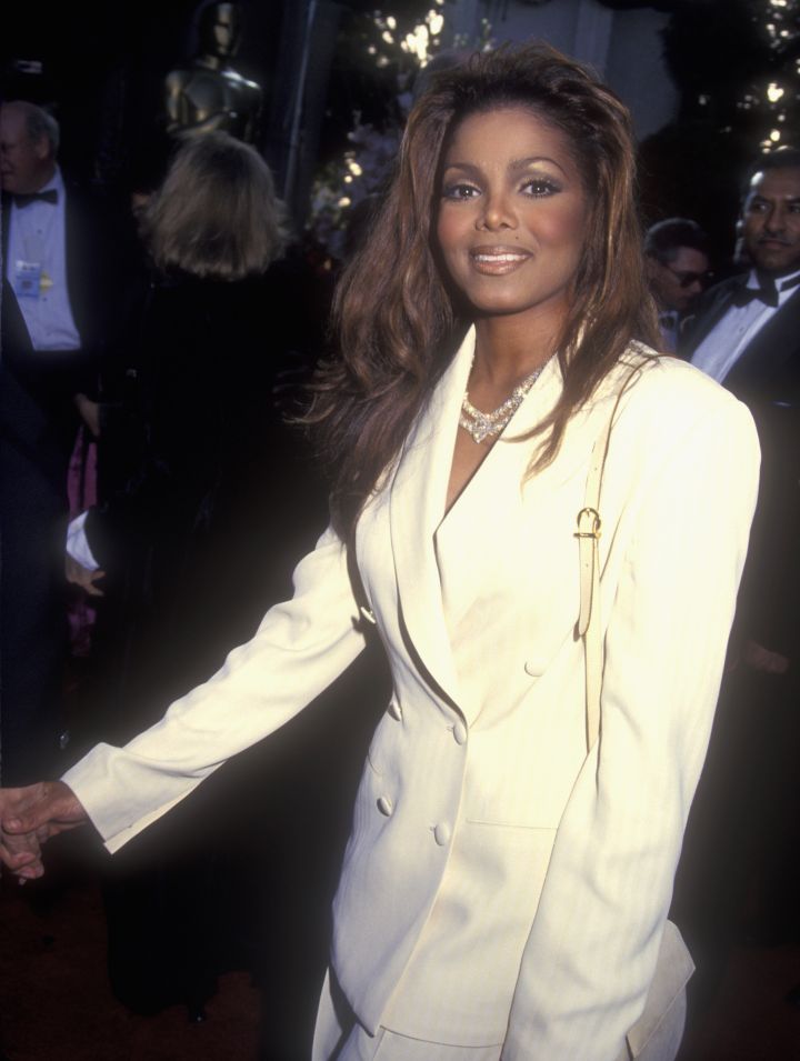 Janet gave the masculine pantsuit a feminine touch.