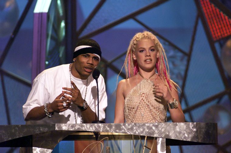 Nelly rocking two headbands and Pink with her pink hair…this photo screams 2001.