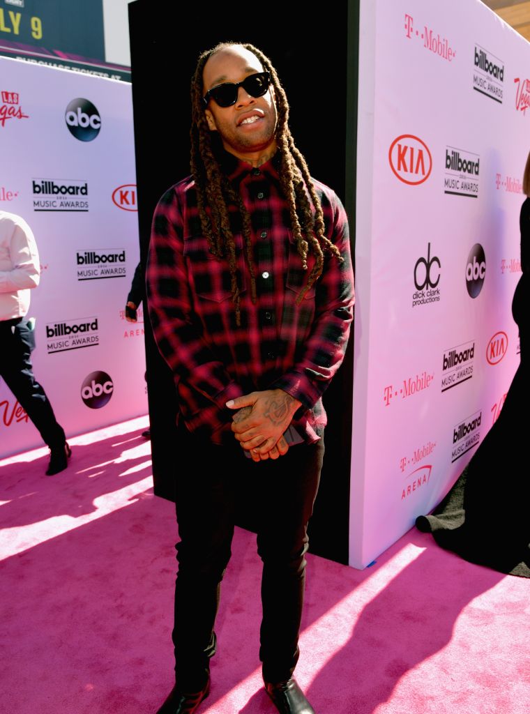Ty Dolla $ign wore a checkered button-up and dark sunglasses.