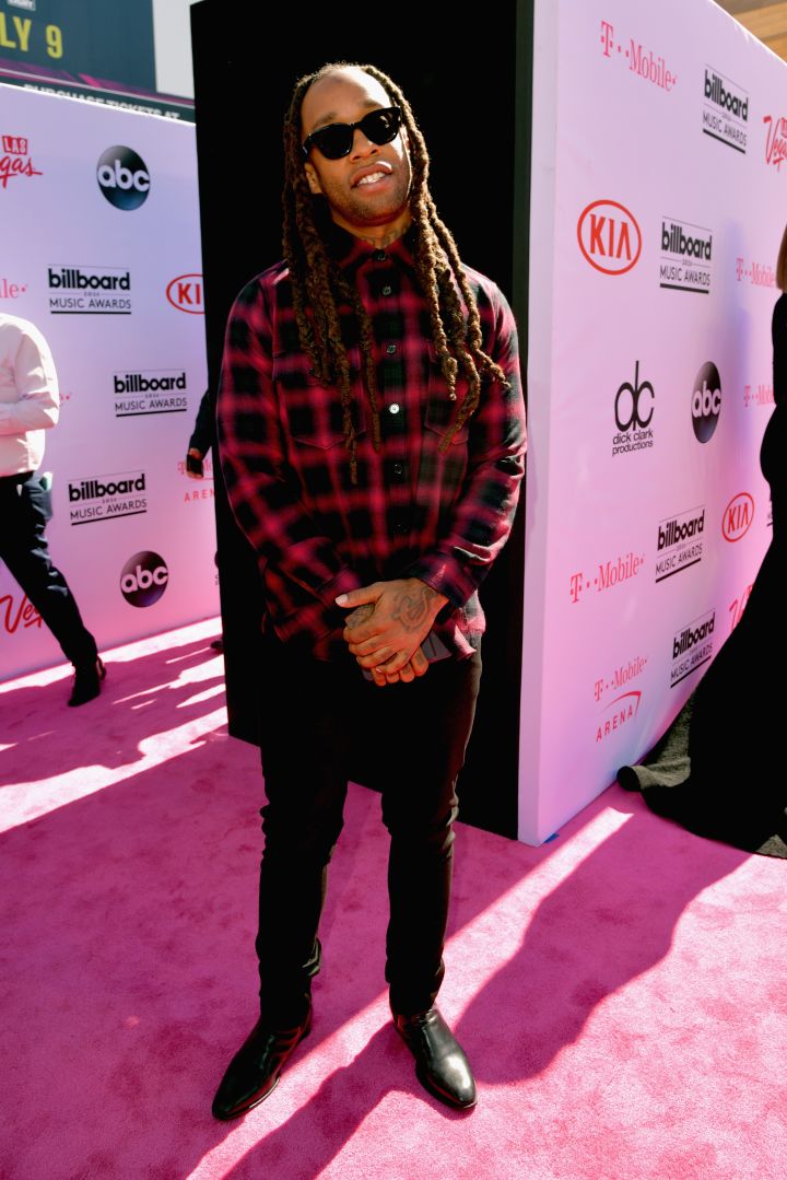 Ty Dolla $ign wore a checkered button-up and dark sunglasses.