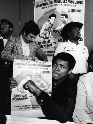 Muhammad Ali Holds Poster For Foreman Bout