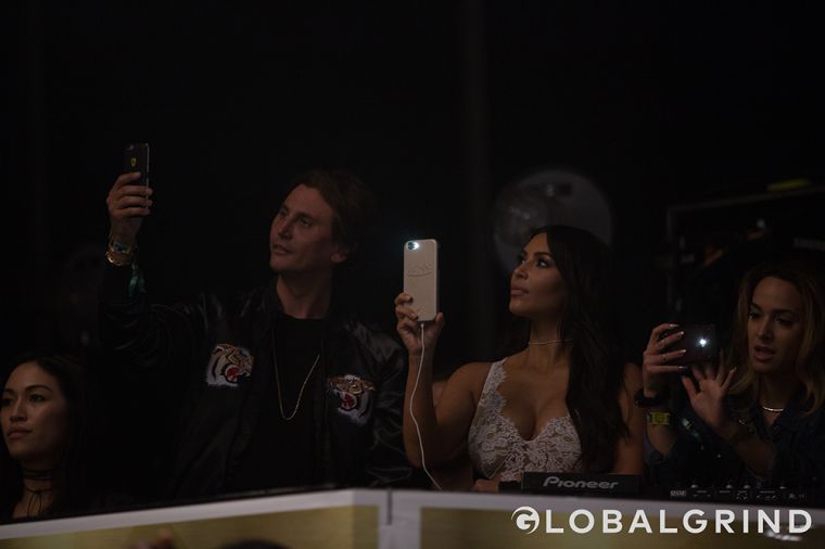 Kim Kardashian watches her husband do the damn thing at Summer Jam.