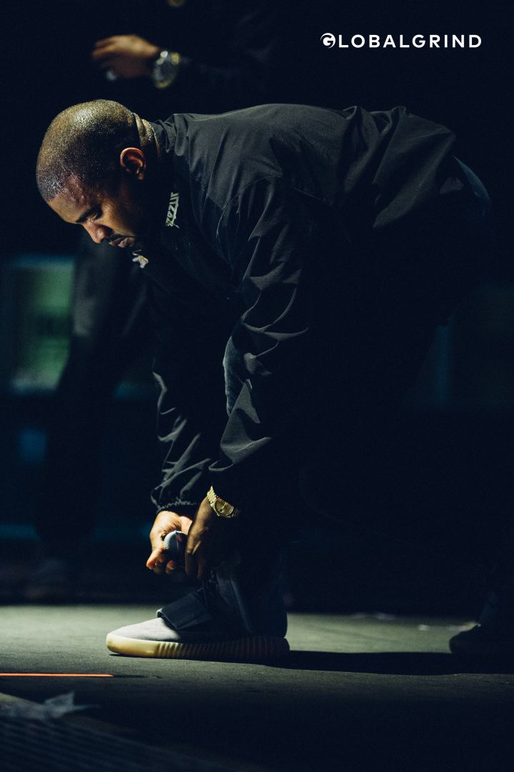 Kanye ties his Yeezys during 2016 Hot 97 Summer Jam at Met Life Stadium.