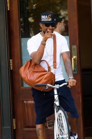 Usher wears a Cleveland Cavaliers "champs" cap in NYC