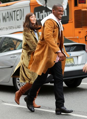 Cam Newton and Karlie Kloss run inbetween cars on a Vogue photoshoot in New York