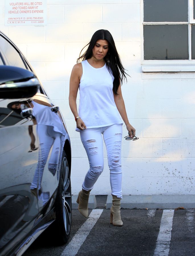 Kourtney Kardashian wearing all white was spotted leaving a studio in Van Nuys.
