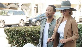 Chrissy Teigan and John Legend shopping and pushing stroller through Beverly Hills, CA