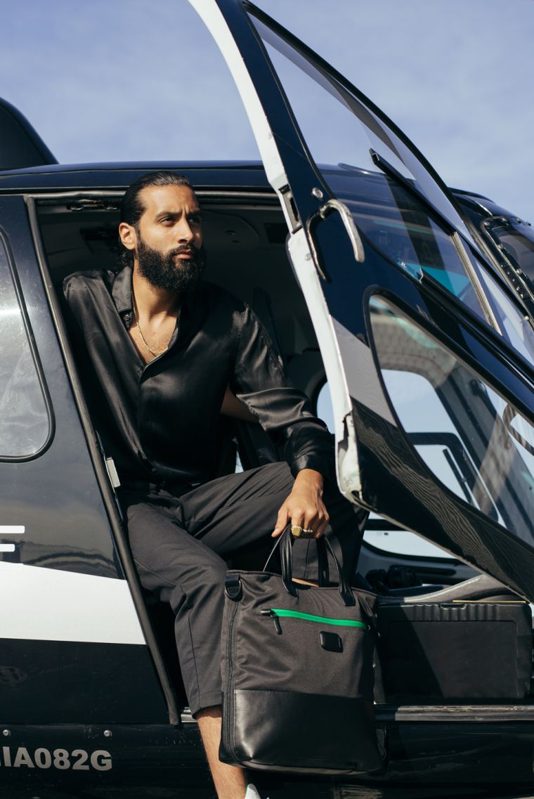 Model Sports His Heineken & TUMI Travel Bag In Miami