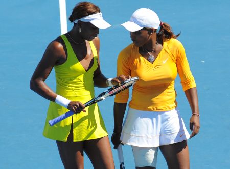 Venus rocks a double slit tennis dress while playing with her sister at the 2010 Australian Open