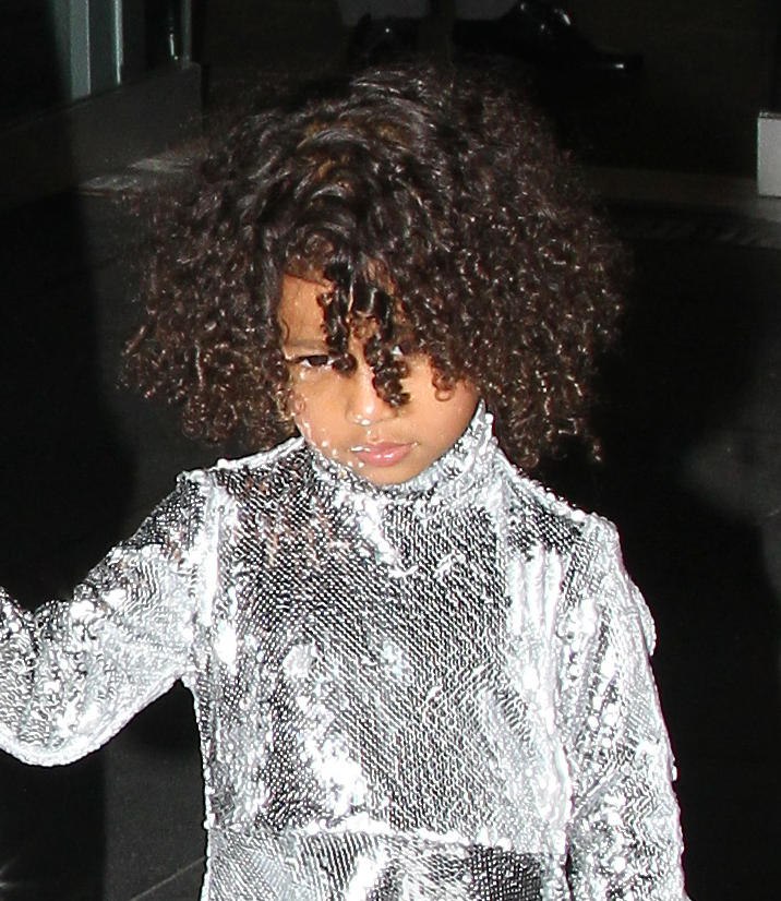Kim Kardashian takes North West in silver sequined outfits out and about in NYC.