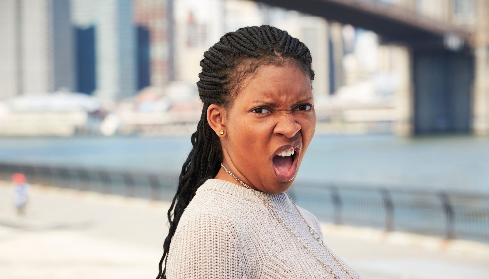 Black woman with disgusted attitude at waterfront