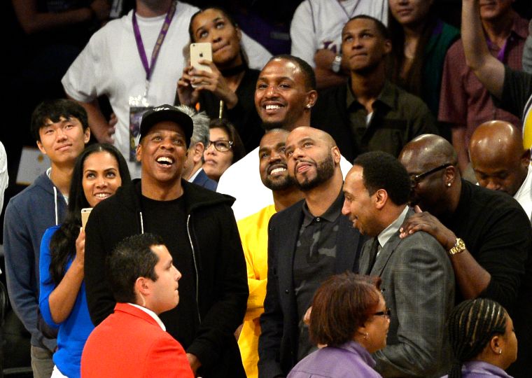 Kanye and Jay Z enjoy an L.A. Lakers game..
