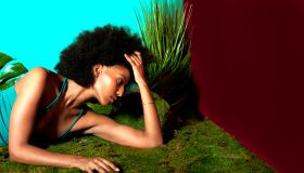 Woman with Afro in colorful nature room
