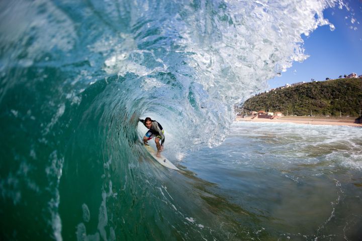 Surfer tuberiding a wave, Brighton Beach, Durban, Kwazulu Natal, South Africa