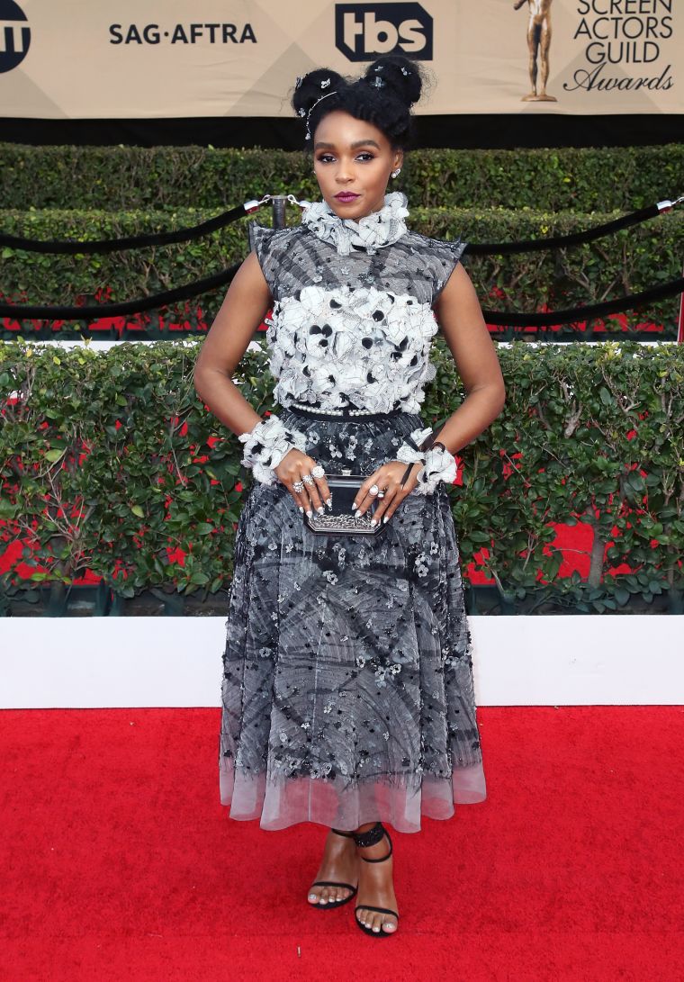 Janelle Monae ditched her usual black and white suit for glam.