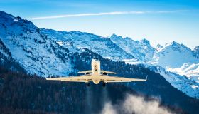 Business Jet departing a snowy airfield