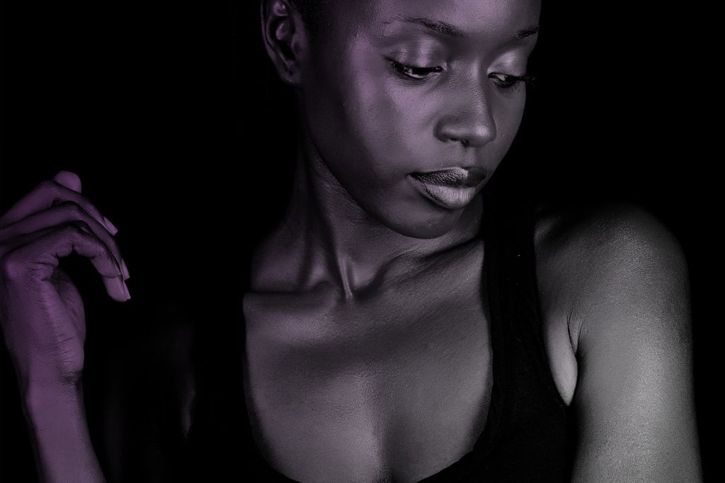 Dark skinned woman pensive
