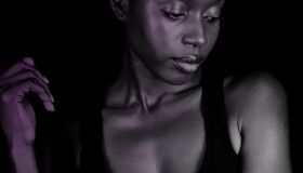 Dark skinned woman pensive